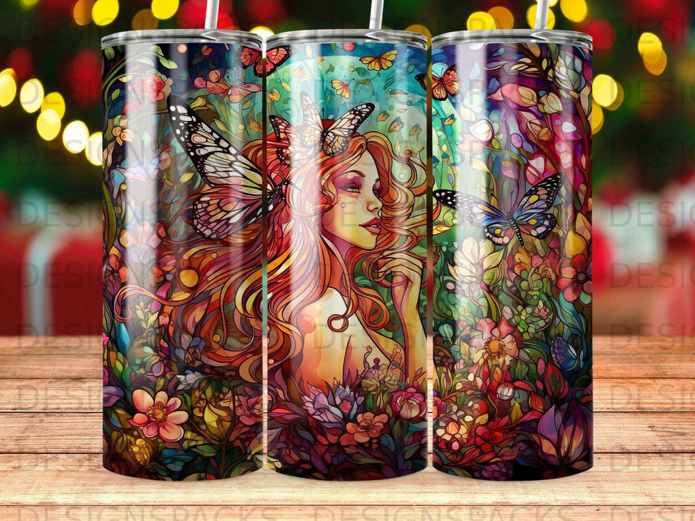 Tumbler with vibrant floral and butterfly design featuring a woman's profile.