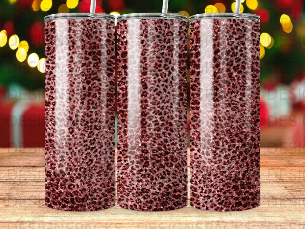 Three tall tumblers with a sparkly red leopard print design.