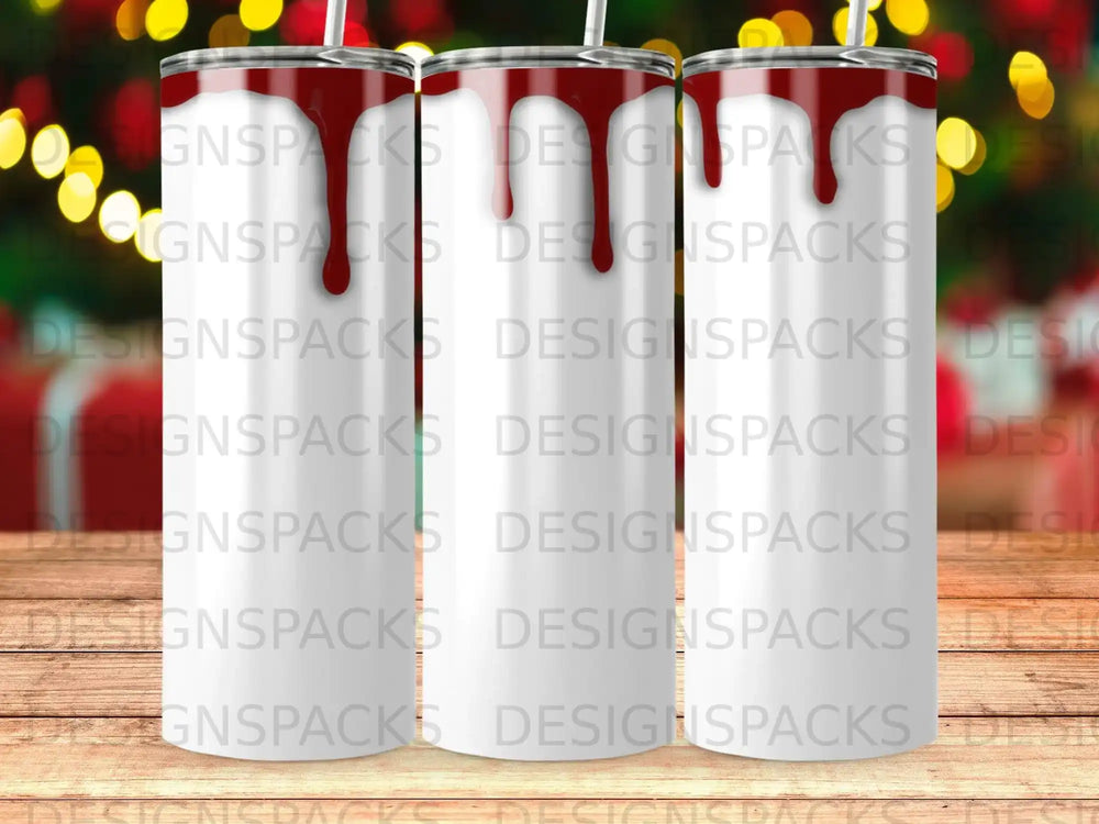 Blank sublimation tumbler with red abstract drips on a bokeh background.