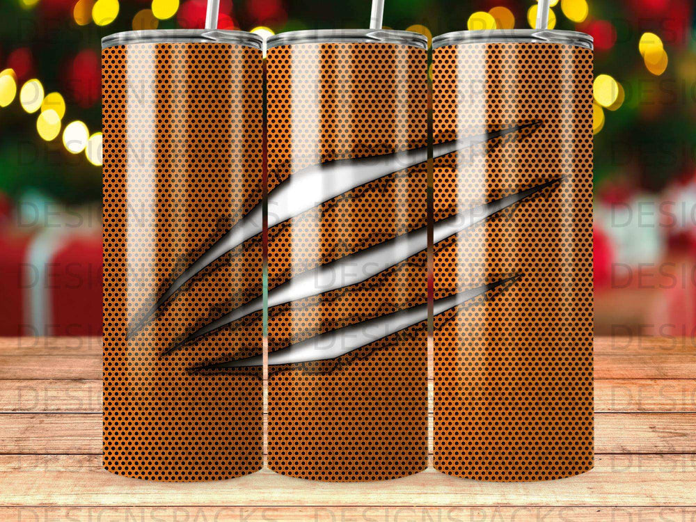 Orange textured tumbler with three claw marks.