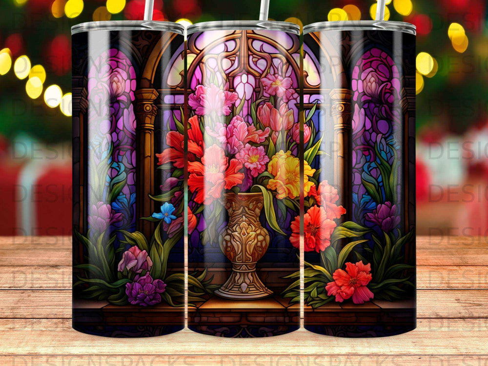 Floral stained glass design on a tumbler with a bouquet of colorful flowers in a vase.