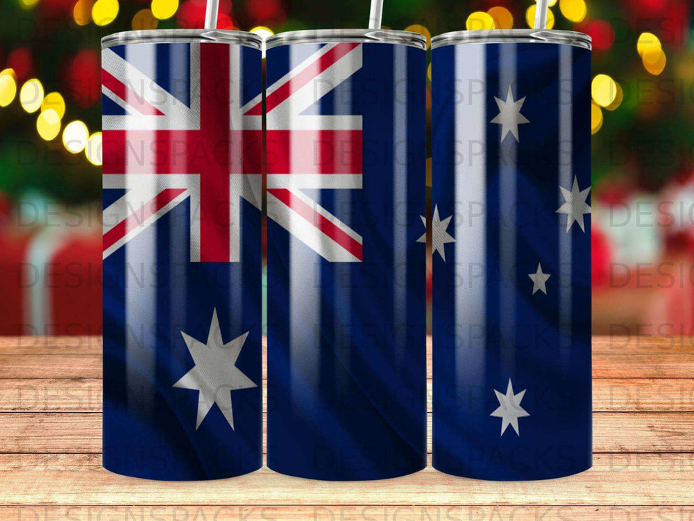 Tumbler with Australian flag pattern and bokeh lights in background.