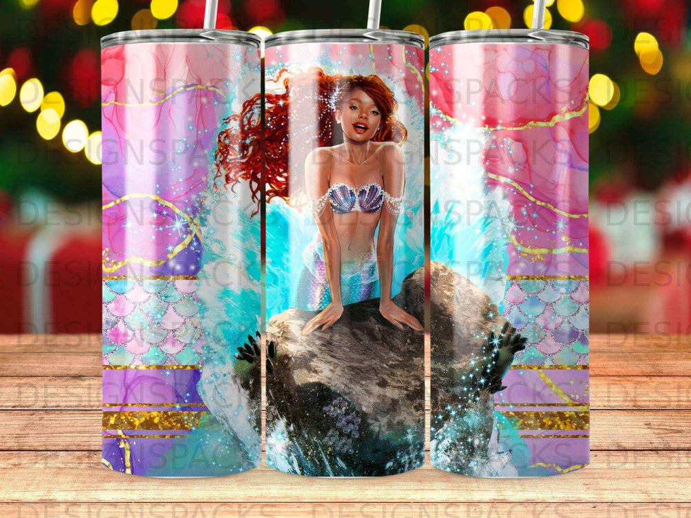 Mermaid with red hair sits on a rock with ocean waves and sparkles.