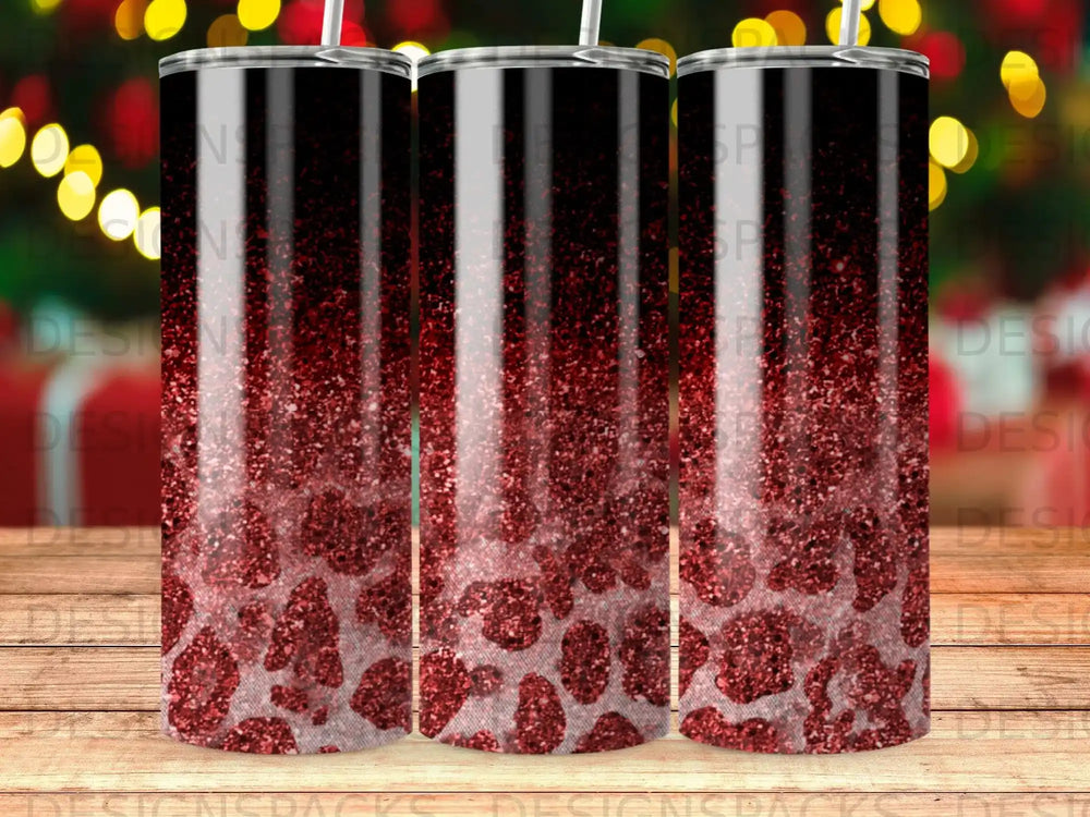 Red glitter leopard print tumbler with black lid.