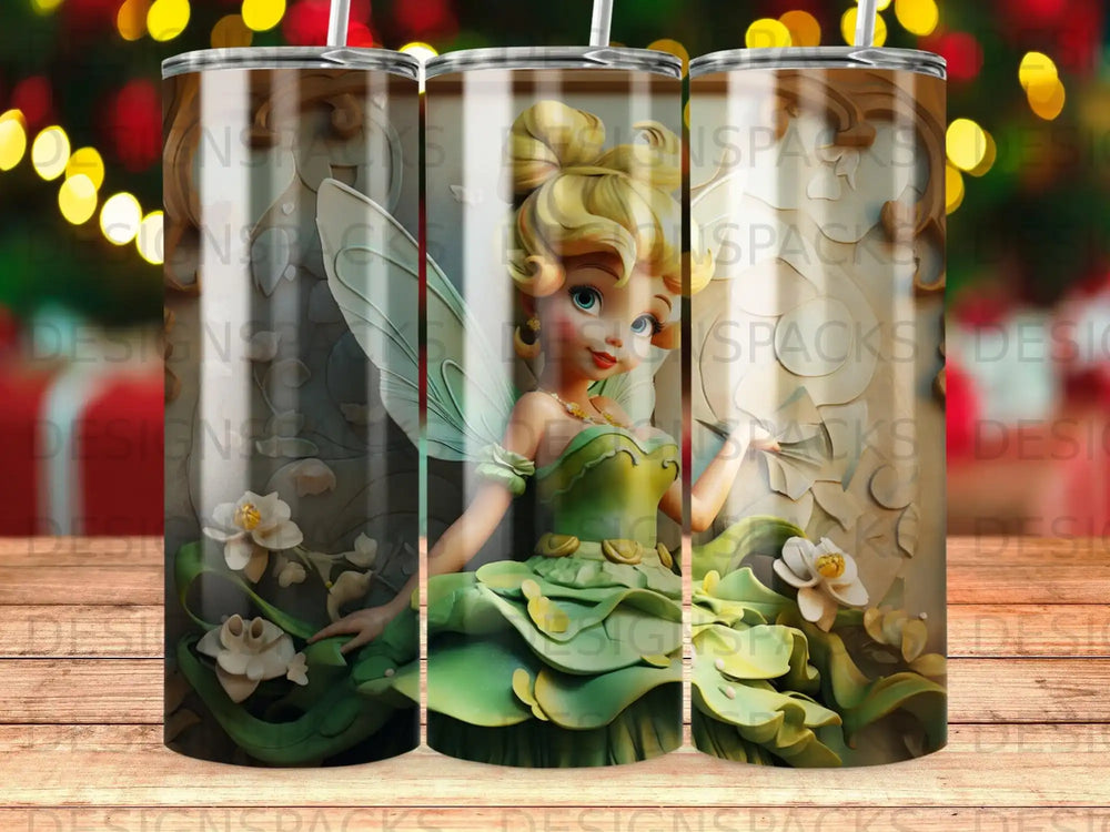 Fairy in a green dress with wings and flowers, centered on a patterned tumbler.