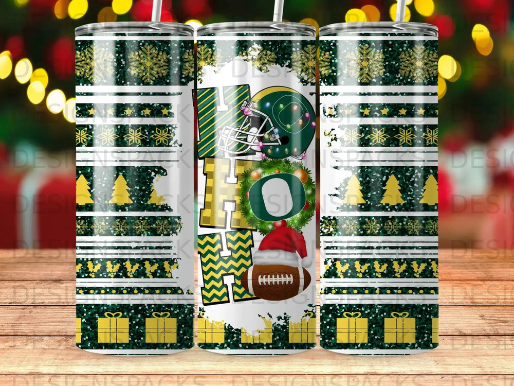 Green and gold holiday tumbler with football, snowflakes, and presents.