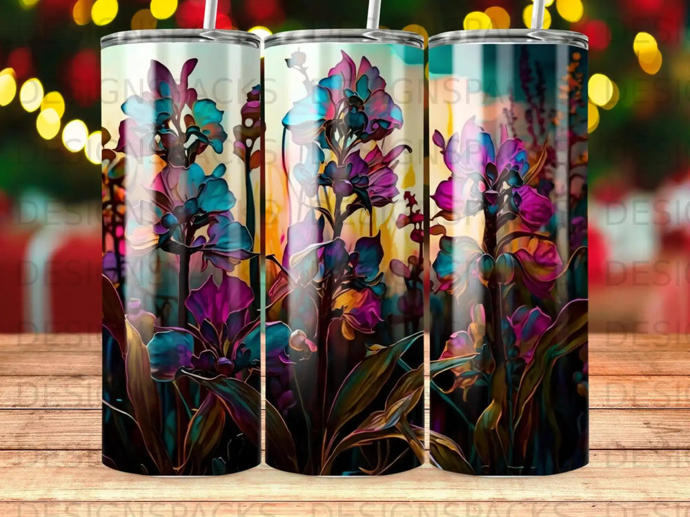 Abstract floral art on three tumblers with a bokeh background.