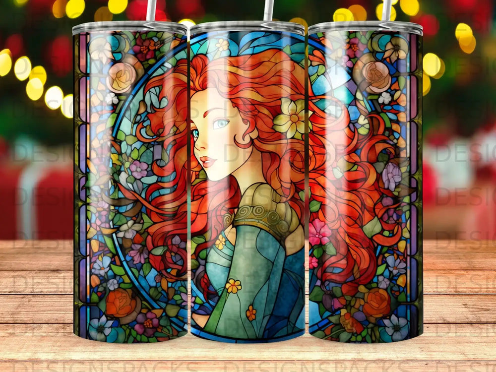 Stained glass tumbler with a woman's portrait and floral designs.