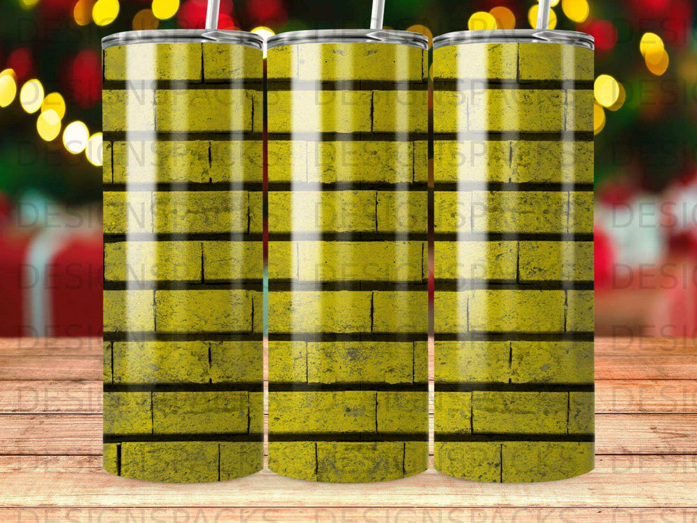 Yellow brick pattern on a tumbler with a straw.