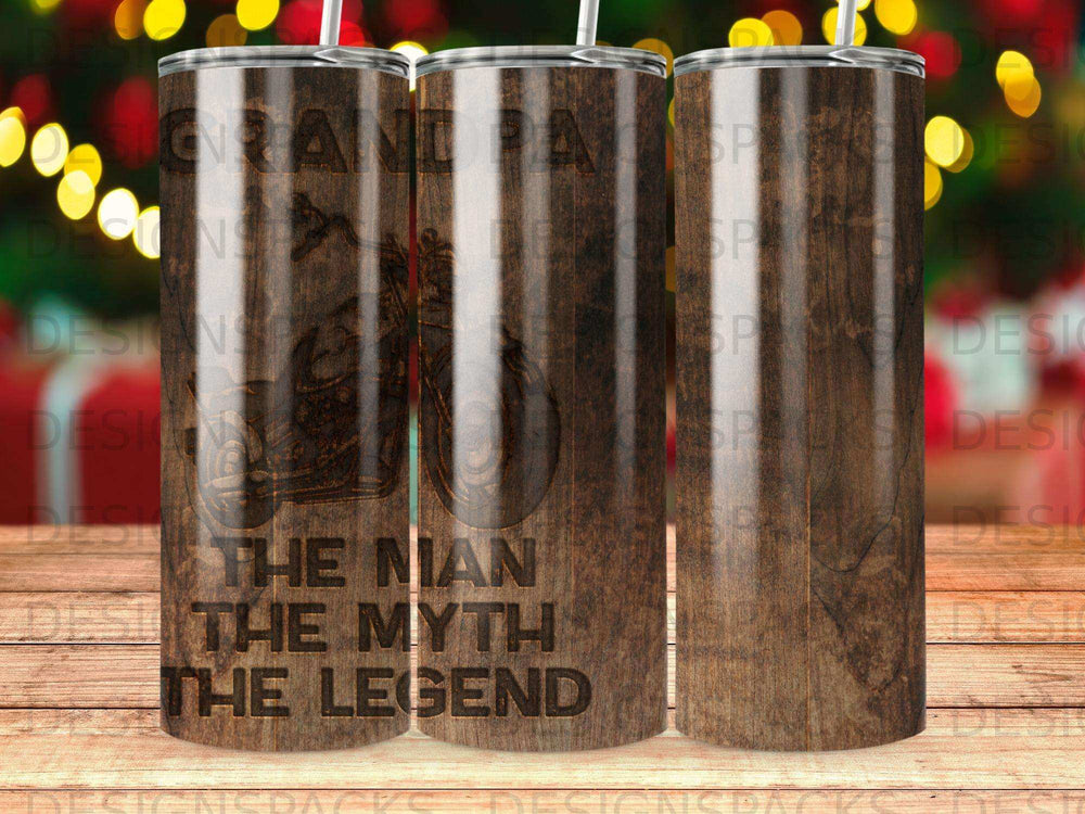 Tumbler with wood grain background, featuring motorcycle and "The Man, The Myth, The Legend" text.
