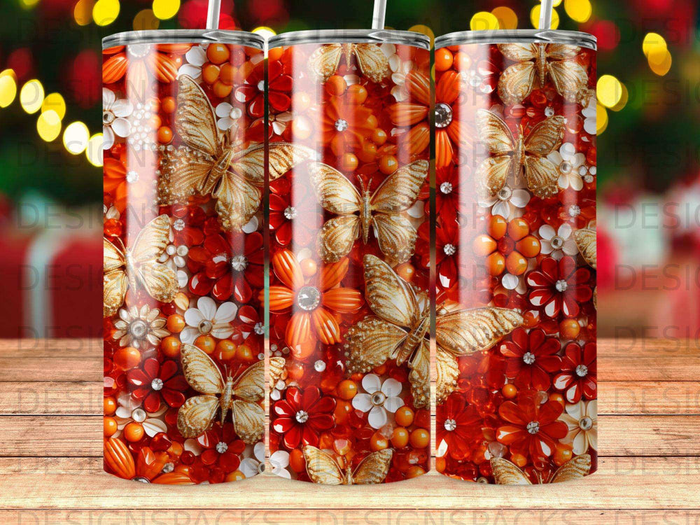 Tumbler with gold butterflies and red and white flowers on a bokeh background.