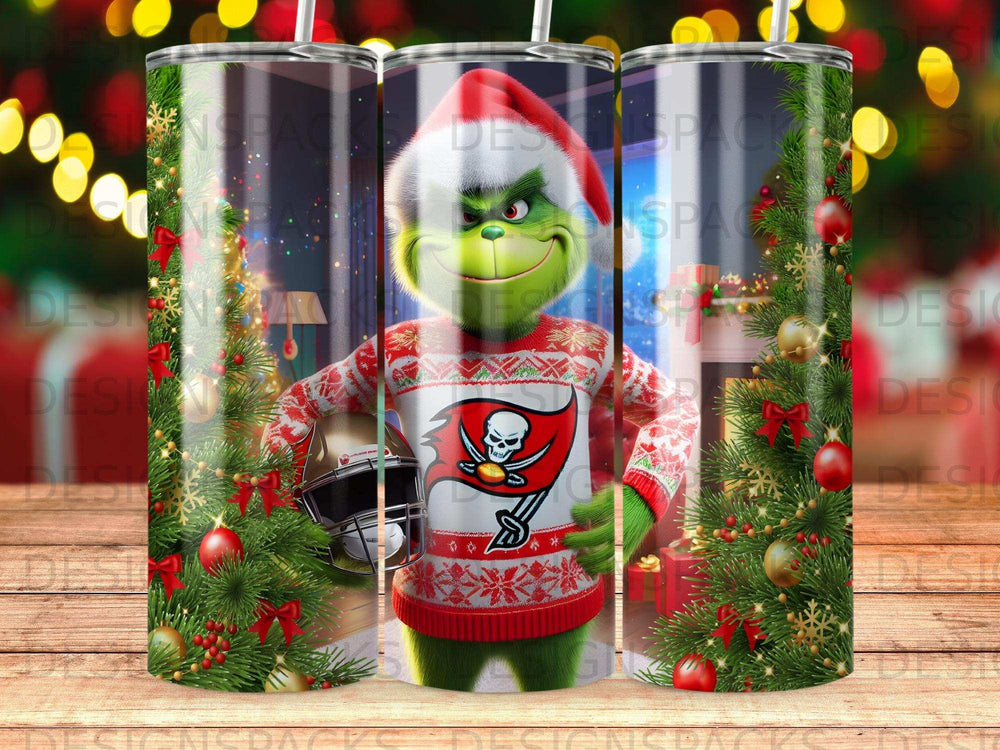 Grinch in a Tampa Bay Buccaneers ugly sweater holding a football helmet with Christmas decorations.