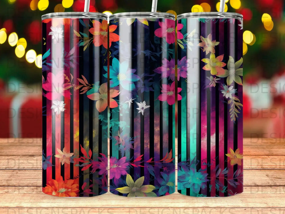 Tumbler with vibrant floral pattern on a striped background.