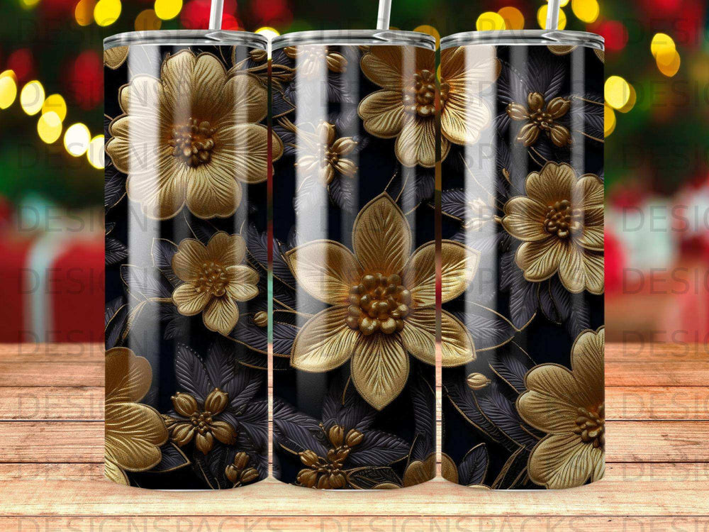 Three tumblers with a dark floral pattern of gold flowers and leaves.