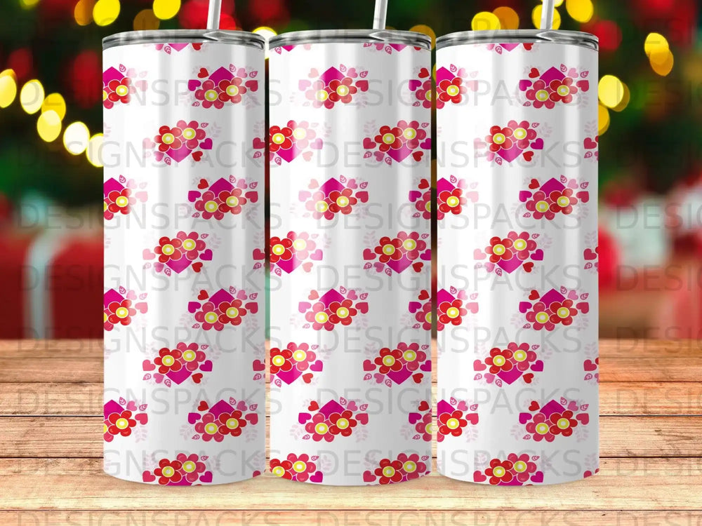 Three tumblers with floral pattern, repeating "DESIGNSPACKS" watermark.