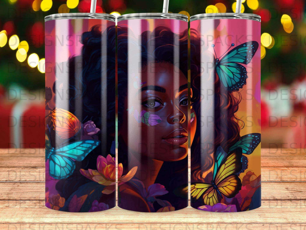 Tumbler with a woman's portrait surrounded by colorful butterflies and flowers.