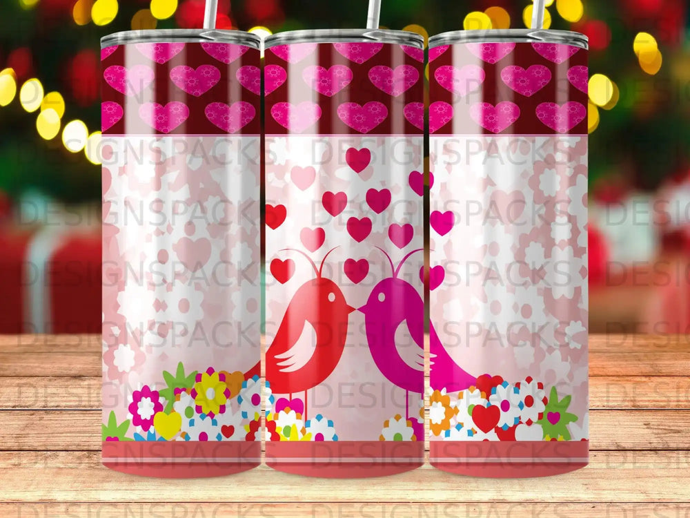 Two birds facing each other on a background of pink hearts and flowers.