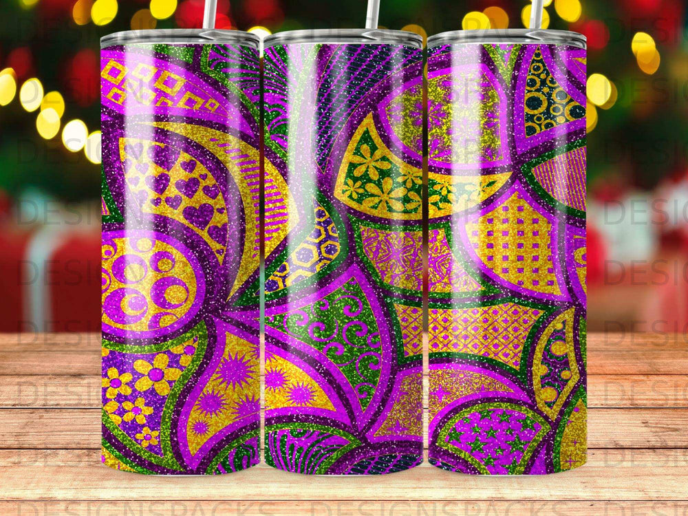 Purple, green, and gold glitter floral tumbler with bokeh background.