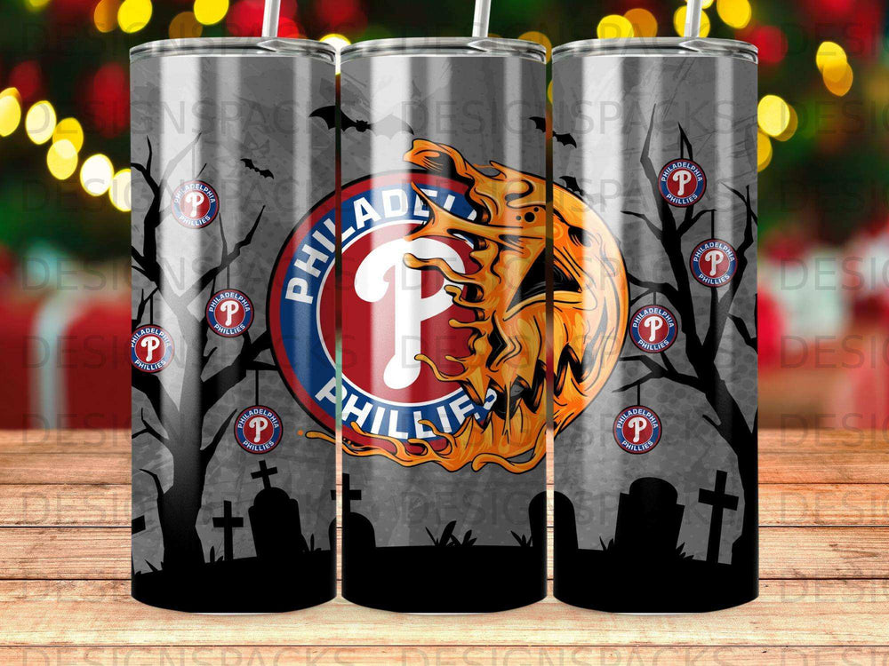 Philadelphia Phillies logo on a spooky Halloween-themed tumbler with trees and tombstones.