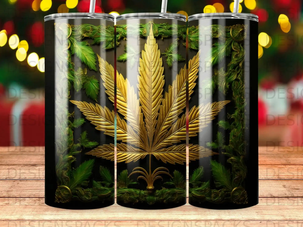 Gold cannabis leaf design on a black tumbler with green foliage accents.