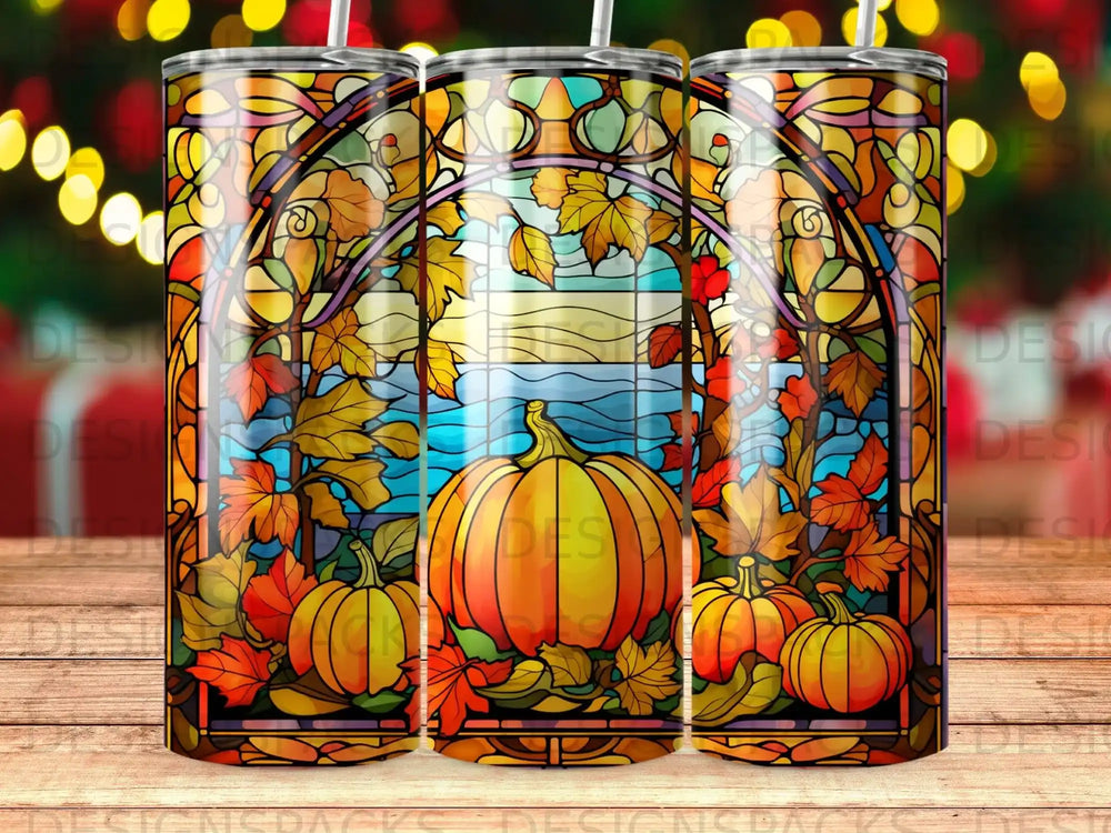 Stained glass tumbler with pumpkins and autumn leaves.
