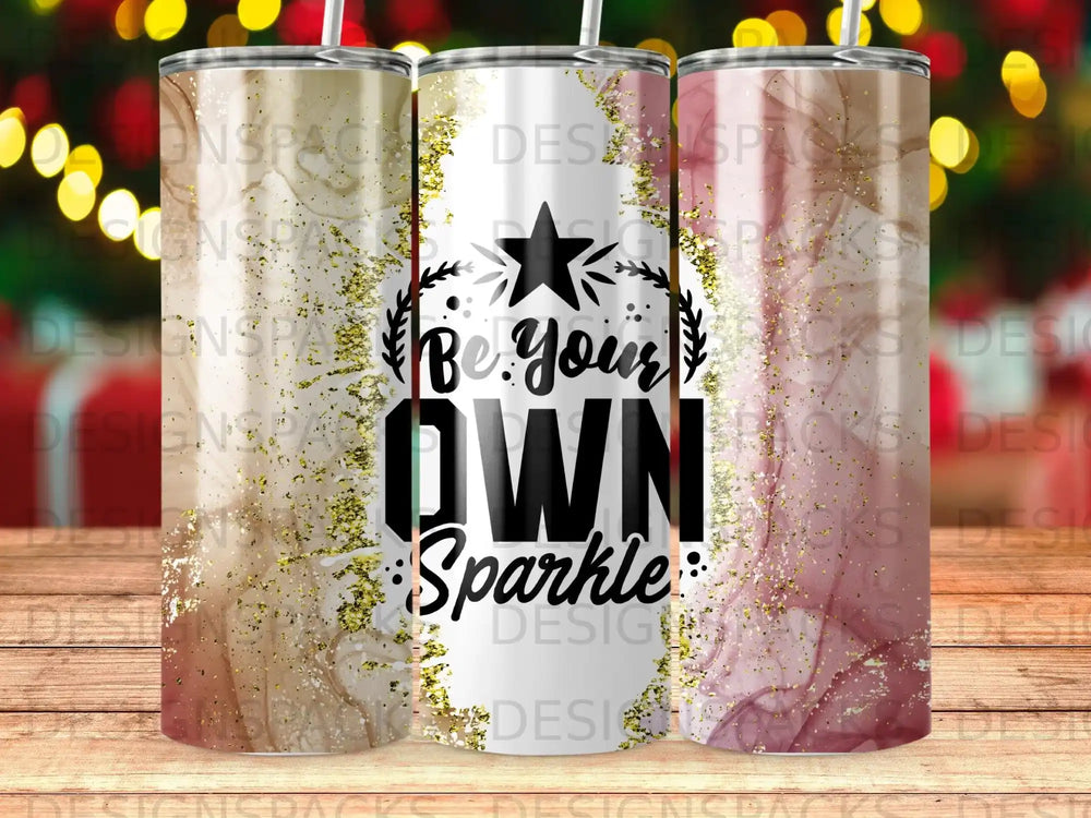 Tumbler with "Be Your Own Sparkle" text and pink and gold marble design.