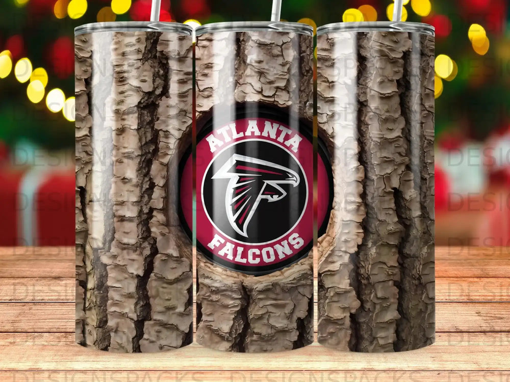Atlanta Falcons logo on a wood grain tumbler with straws.