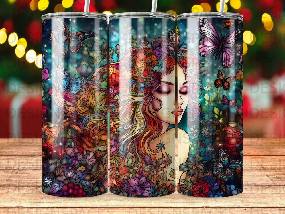 Tumbler with colorful floral and butterfly design featuring a woman's profile.