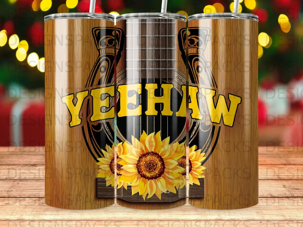 "Yeehaw" text with sunflowers and acoustic guitar on a tumbler.