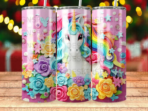 Pink tumbler with a unicorn surrounded by colorful flowers and rainbow mane.