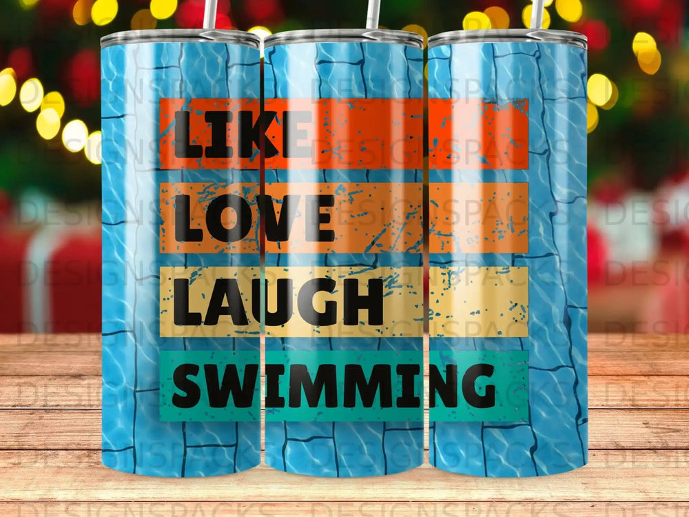 Tumbler with "Like Love Laugh Swimming" text over a pool tile background.