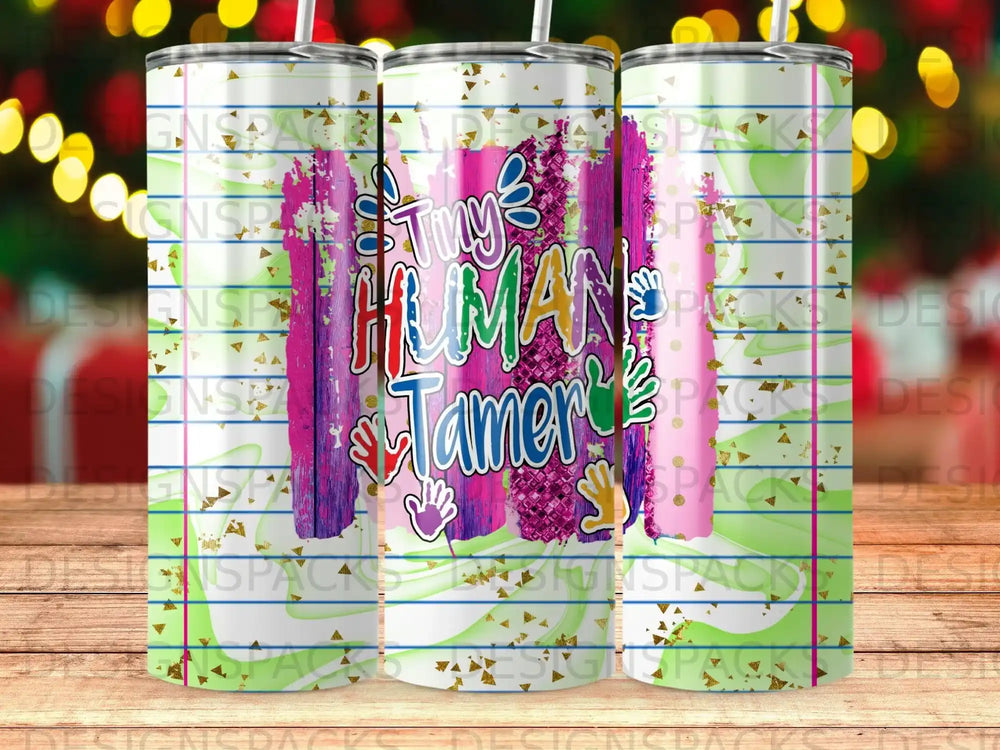 Tumbler with "Tiny Human Tamer" text and colorful handprints.