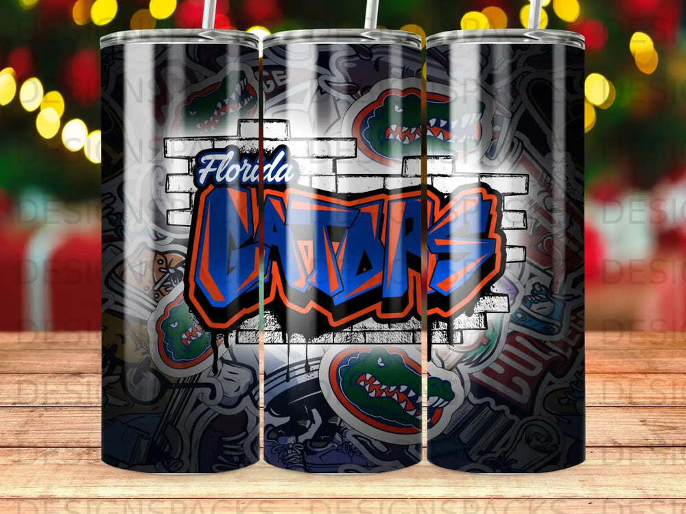 Florida Gators graffiti art on a tumbler with brick and sticker background.