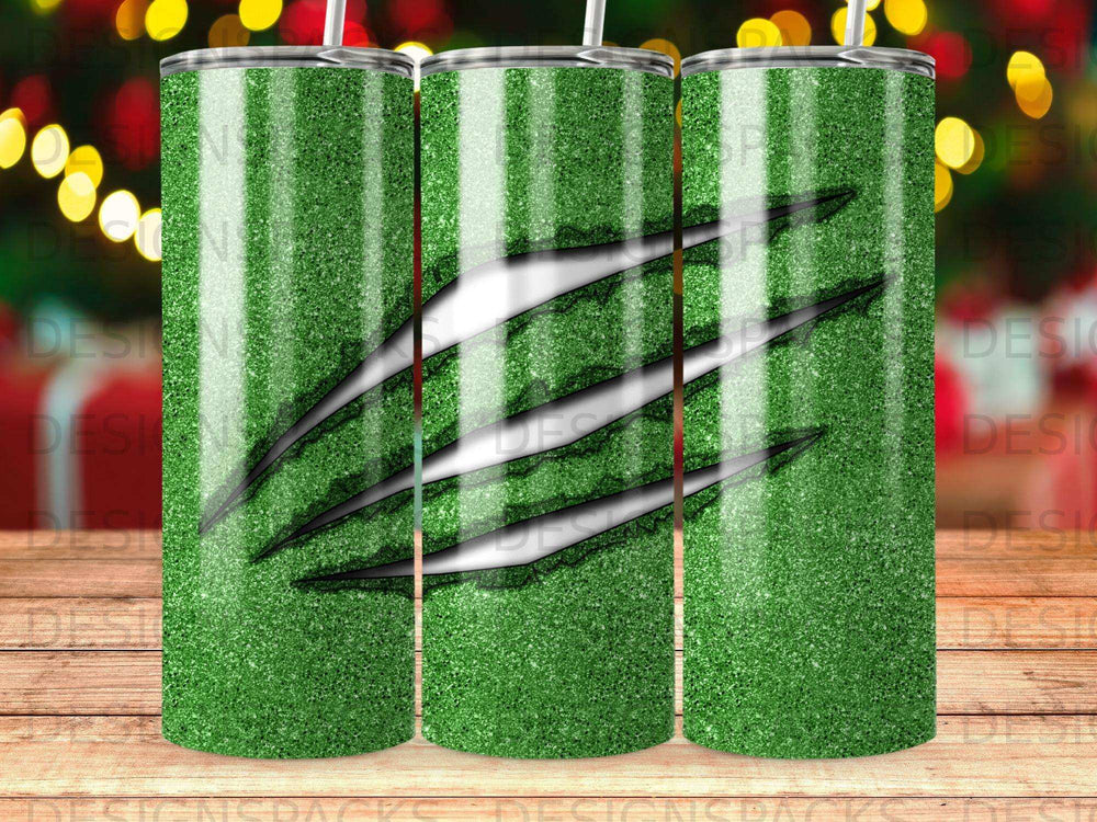 Green glitter tumbler with claw marks design.