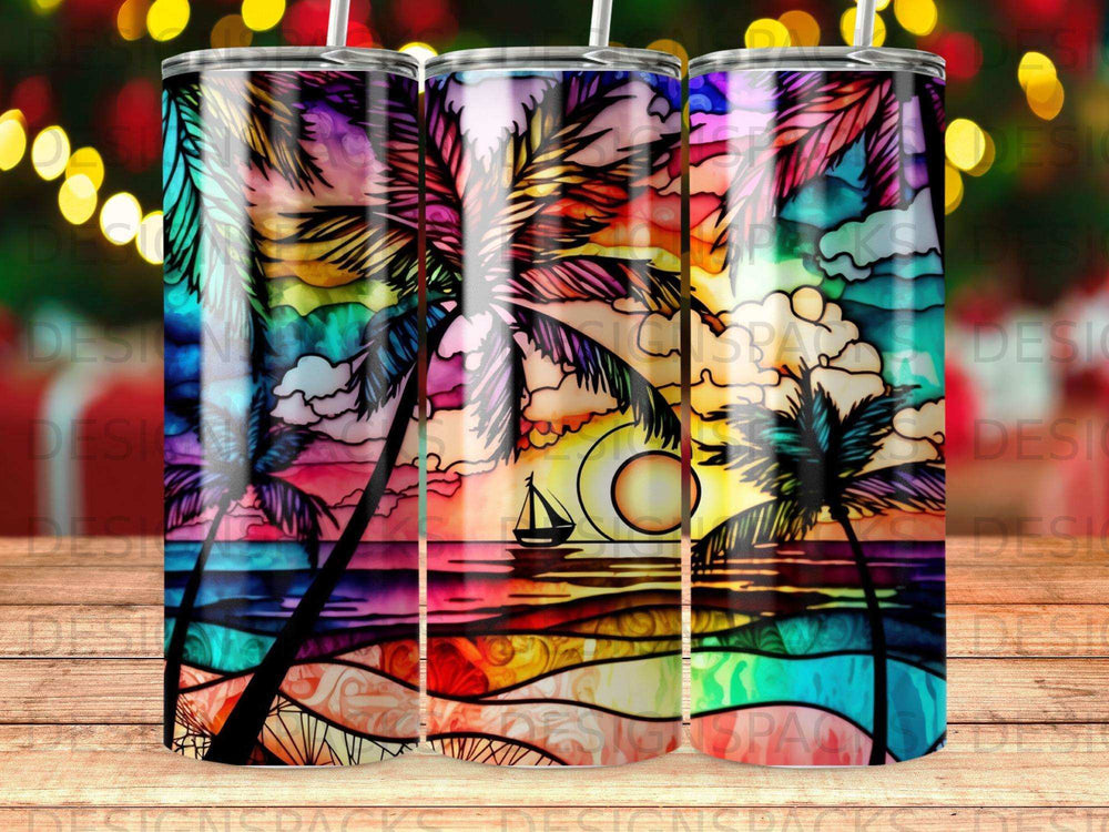 Rainbow stained glass tumbler with palm trees, ocean, and sailboat at sunset.