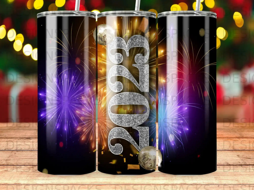 2023 New Year's Eve design on a tumbler with fireworks and glitter.