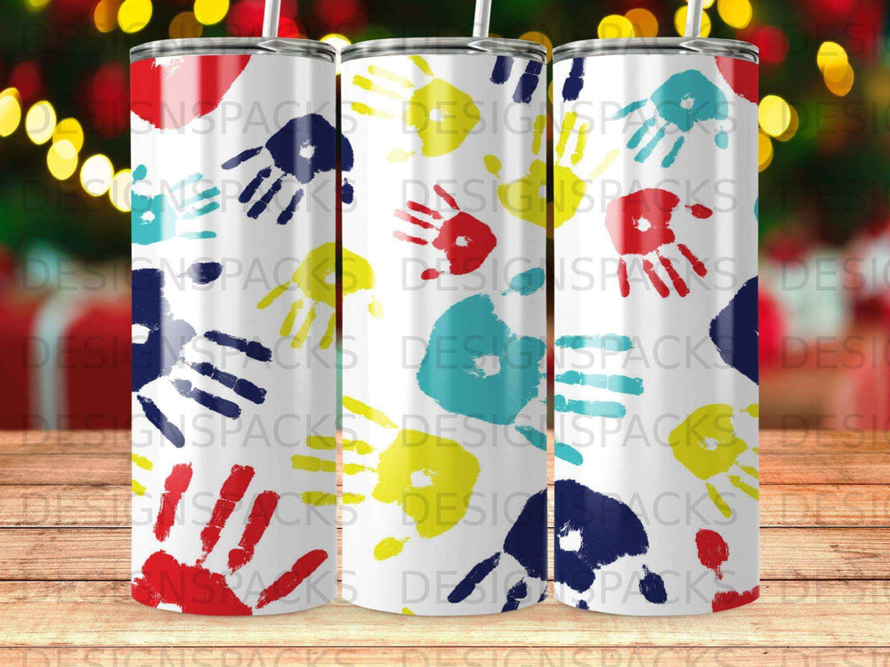 Three tumblers with colorful handprint patterns and "DESIGNSPACKS" text.