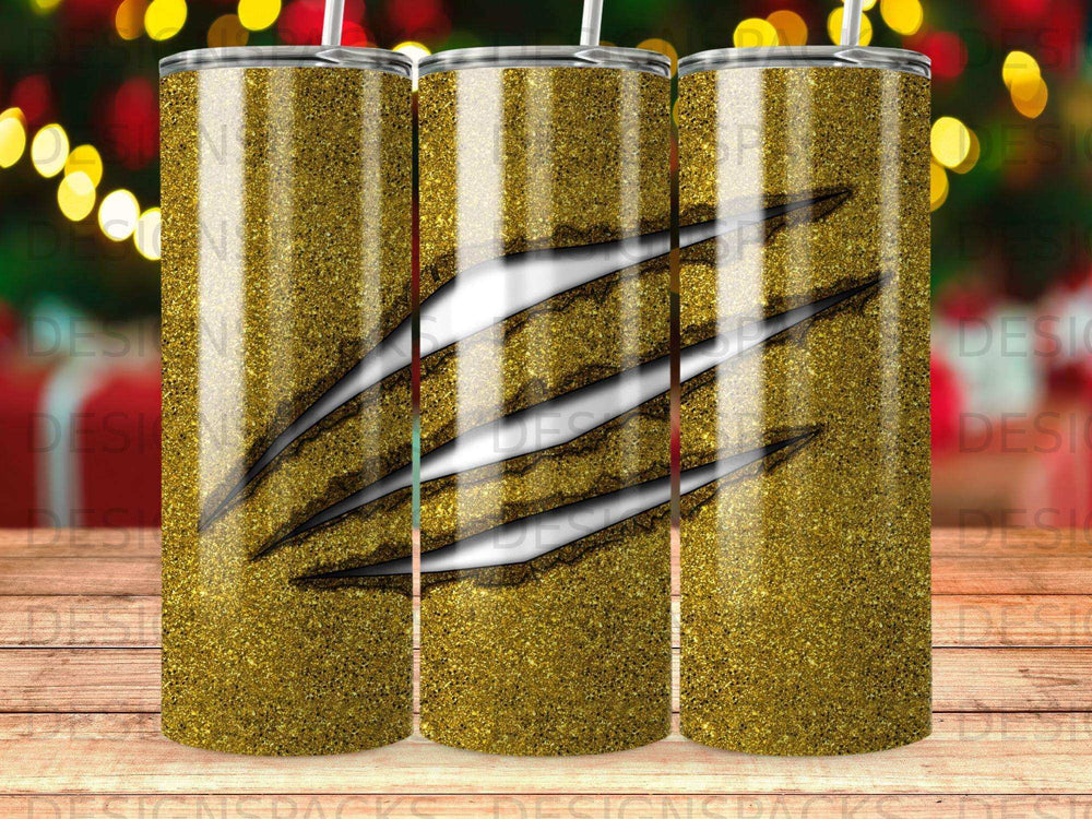 Gold glitter tumbler with black claw marks across the front.