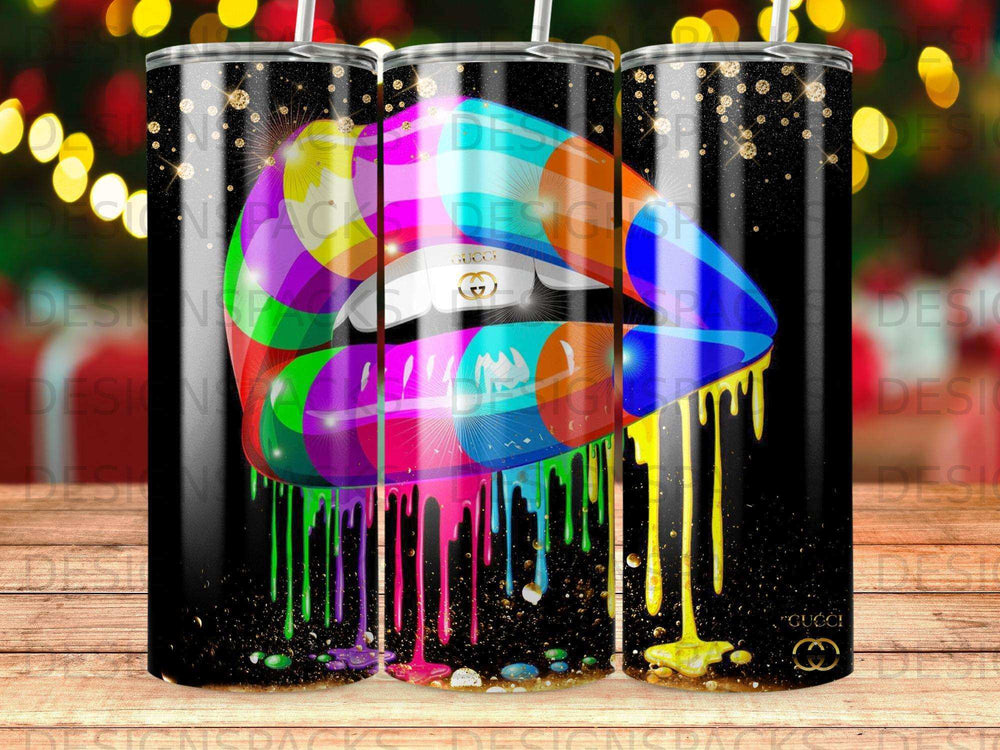 Colorful dripping lips design on a black tumbler with glitter accents.