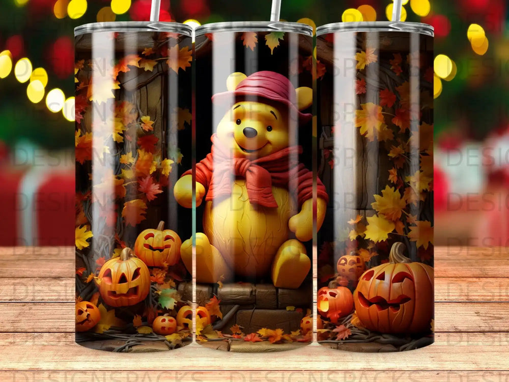Winnie the Pooh sits with pumpkins and autumn leaves.