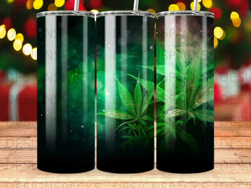 Green cannabis leaves with glittering bokeh lights on black background tumbler.
