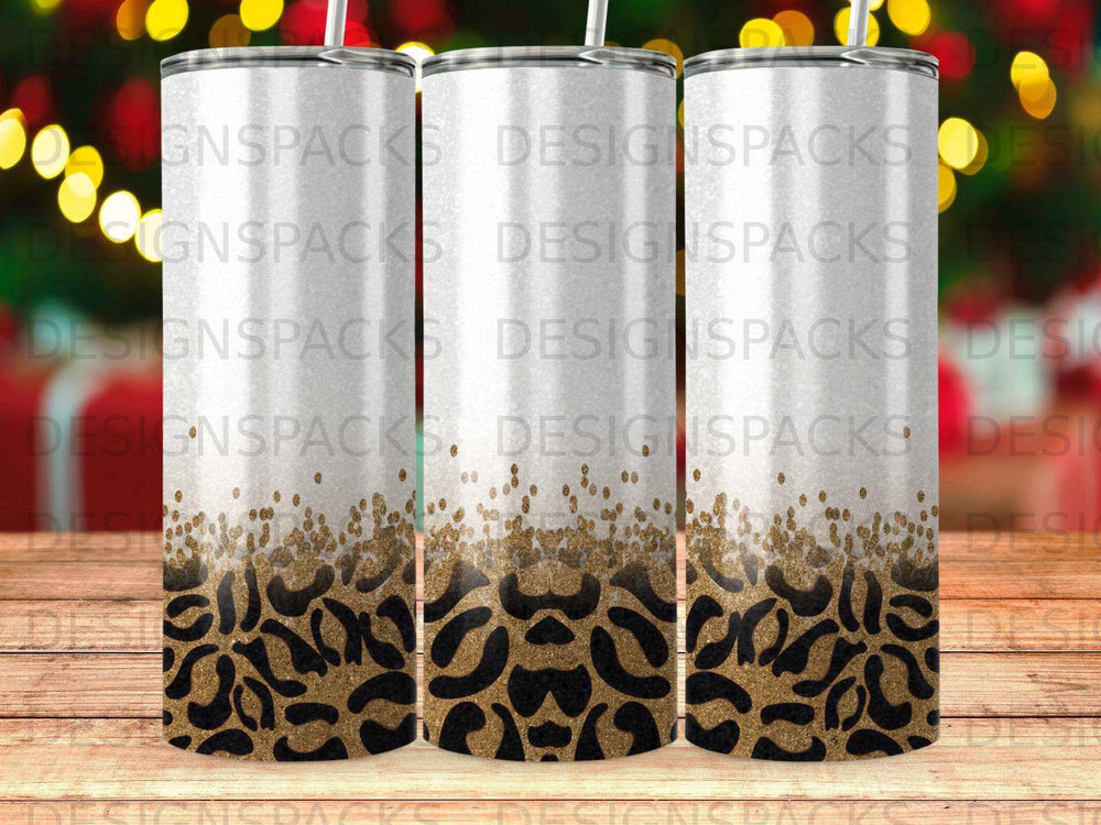 Three tumblers with leopard print and glitter accents.