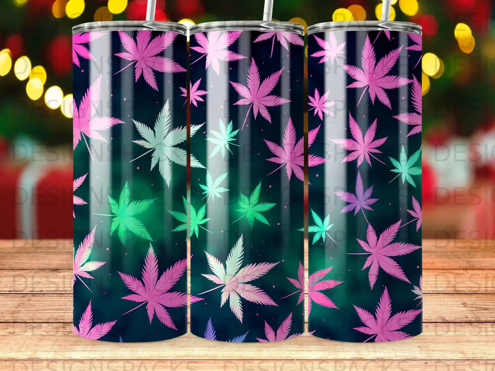 Three tumblers with pink and green cannabis leaf pattern on dark background.