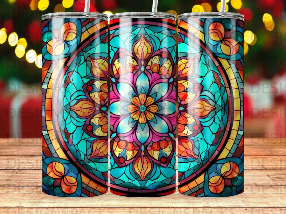 Stained glass mandala pattern on a tumbler with blurred festive lights background.