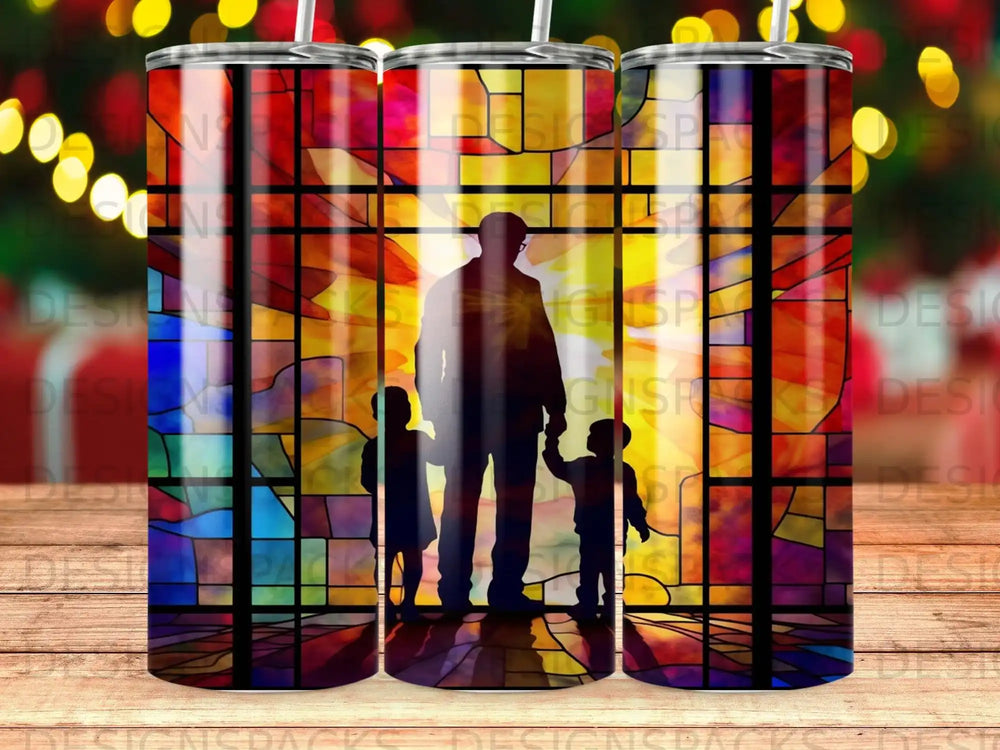 Silhouette of a man and two children standing before a stained-glass window.