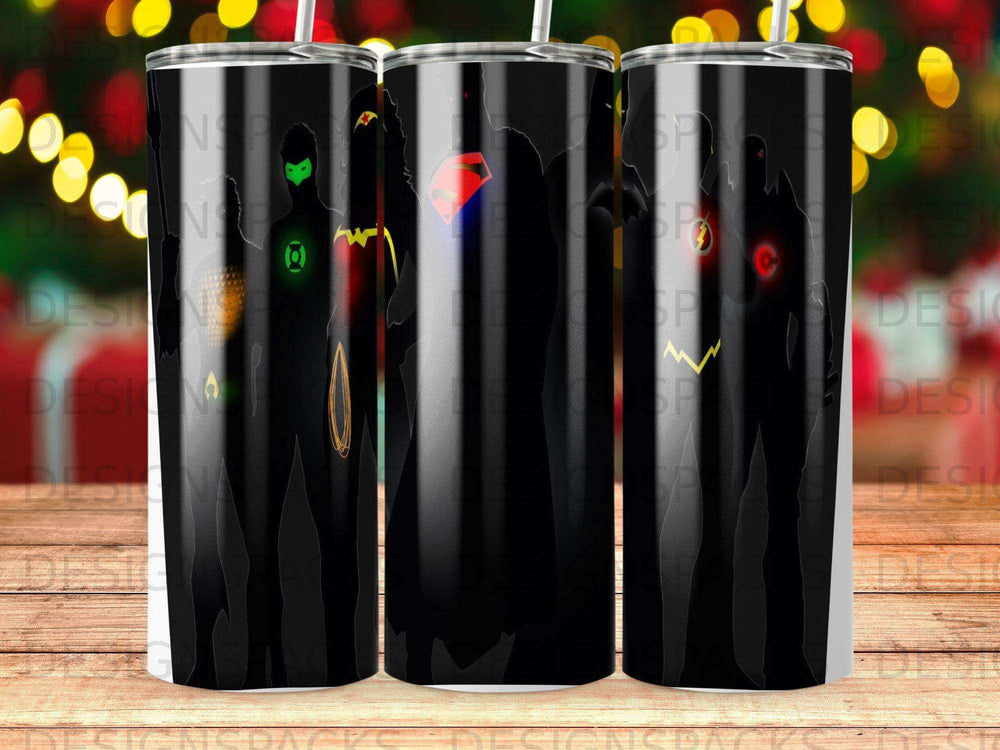 Silhouettes of DC superheroes including Superman, Green Lantern, and Flash on a black tumbler.
