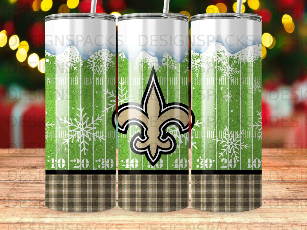 New Orleans Saints logo on a tumbler with plaid and snowflake pattern.