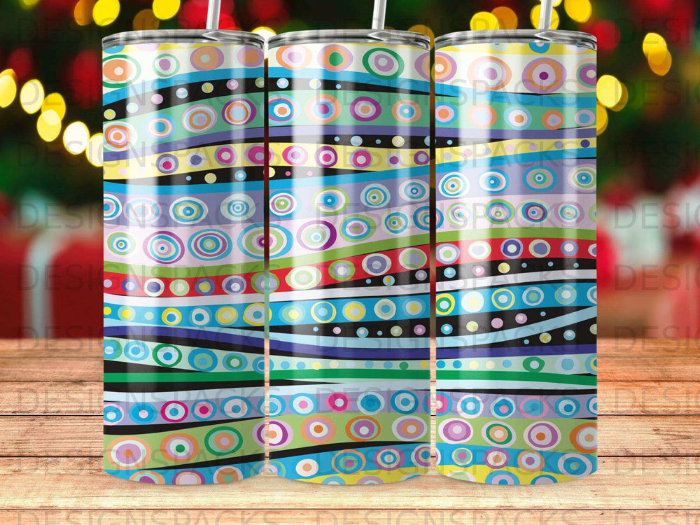 Three tumblers with colorful concentric circles and wavy horizontal stripes.