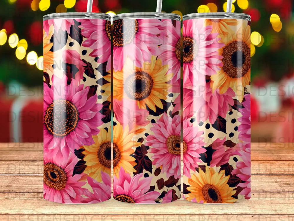 Pink and yellow sunflowers with black speckles on a tumbler.
