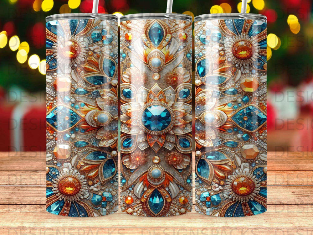 Three tumblers with intricate blue and orange jeweled floral patterns.